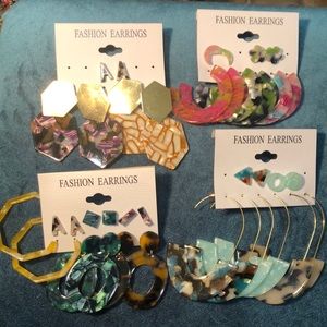 19 pairs of assorted acrylic earrings.